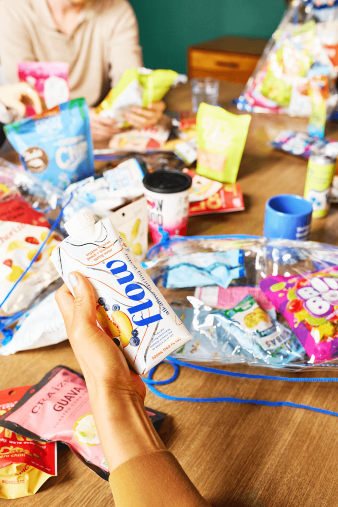 Photo of large snack spread on a conference room table about to be enjoyed by employees.