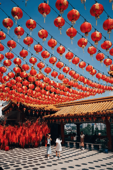 A street decorated for Lunar New Year with hundreds of red lanterns.