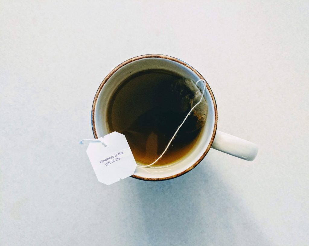 A shot from above looking down on a mug full of fresh warm tea. 